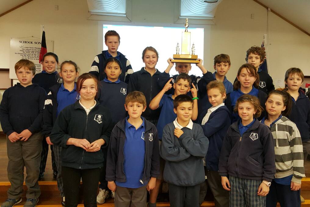 Thurgoona Public School students celebrate their win at the district chess competition beating eight other teams. 