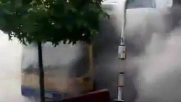 Smoke billowing from the bus at Moorooka. Photo: Twitter / ABC