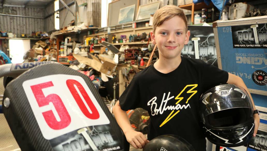 Brock Barber, 9, with the Kosmic OTK kart he'll pilot around the track at Cameron Park this weekend. Picture: David Stewart