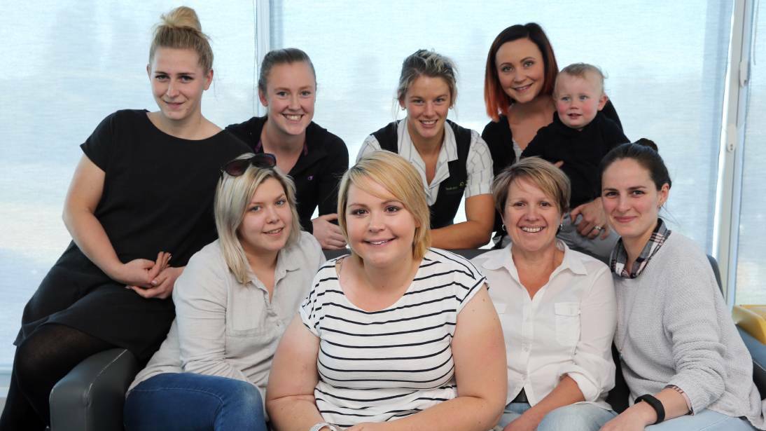 Amy Phillips (centre), surrounded by her mum and friends, has been diagnosed with a terminal cancer and would like to meet singer Robbie Williams when he visits Sydney on November 21. Picture: Rob Gunstone
