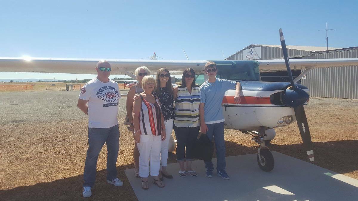 Glen Sparks (right) celebrates with his family before taking off on his first solo flight. Photo: Supplied.