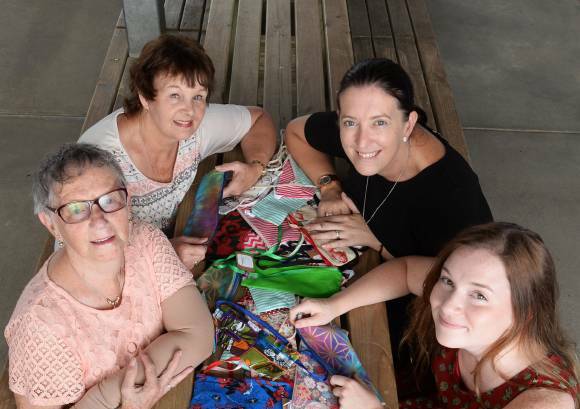 CARING HANDS: The Hailey Project was inspired by Swim and Survival Academy manager Hailey Eeles, back right, with founder Eliza de Kort, front right, and helpers Joan Neil, front left, and Pam Clark. Picture: Kate Healy
