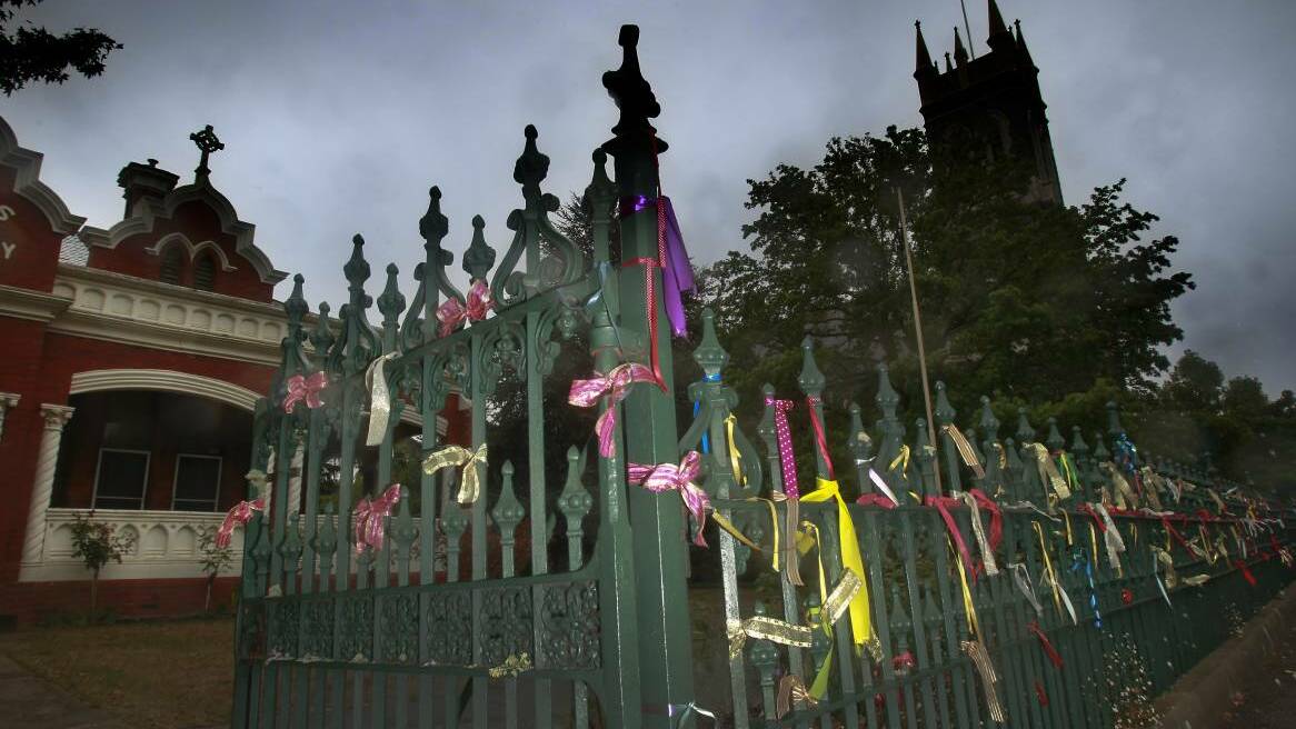 St Alipius Presbytery and Church in Ballarat where ribbons are tied to the fence to symbolise the abuse of Catholic priests.
