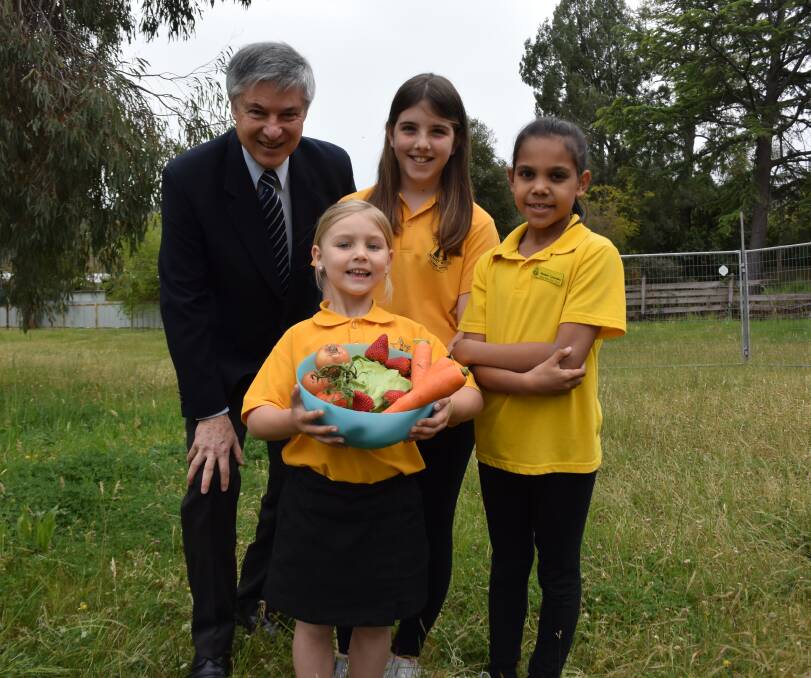 Fruitful venture: Greg Aplin with Albury West pupils Lucy Kimball, Searn Maher and Tamanah Mobourne in part of their school yard to become a vegetable patch.