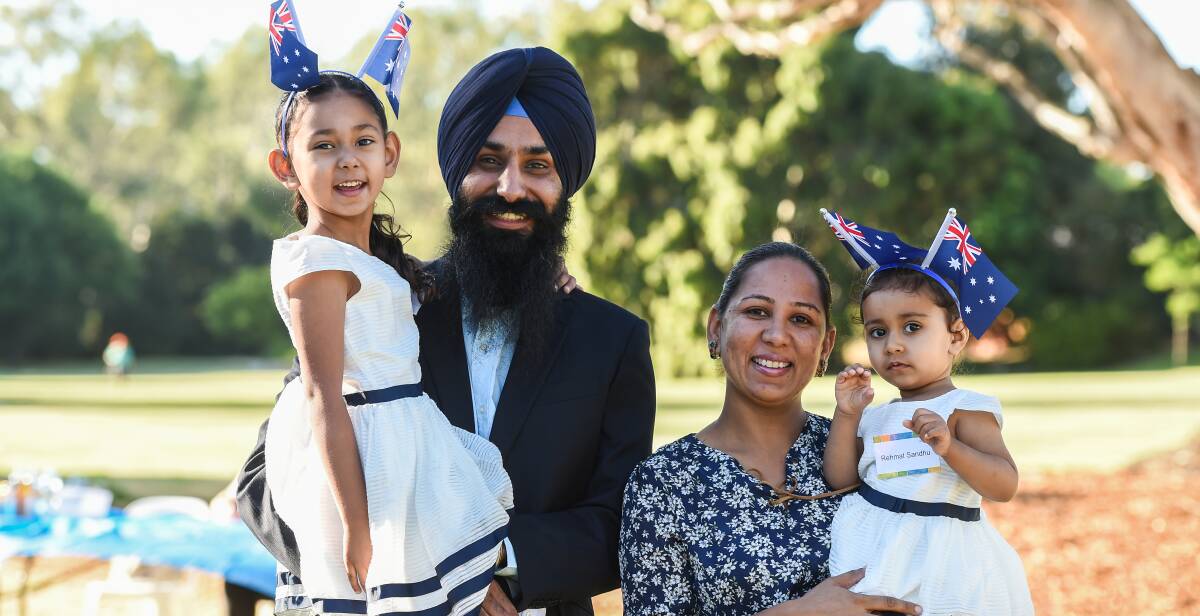 Aussies anew: Thaminder Sandhu with his wife Amandeep and daughters Nayamat, 5, and Rehmat, 20 months, following his citizenship ceremony.