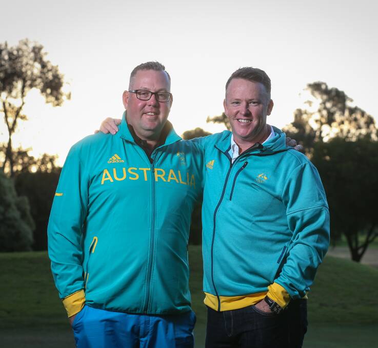 Sold on the green and gold: Jason Wallis and Marcus Fraser at Corowa Golf Club on Saturday evening. Hundreds turned out to welcome them home from the Rio Olympics. Pictures: JAMES WILTSHIRE