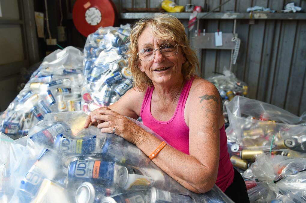 Happy collector: Cindy Carter is delighted she is getting more value for returning cans after having previously taken a $1 a kilo for her receptacles. Picture: MARK JESSER