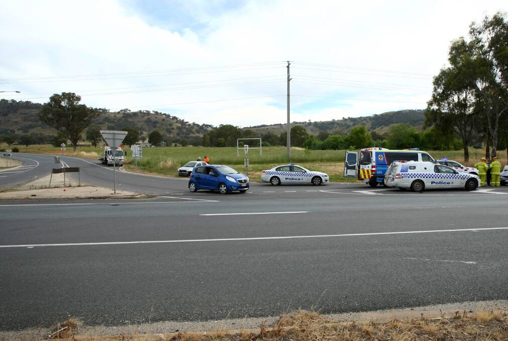 New look: Police attend a crash at the intersection of the Hume Freeway and McKoy Street. A United petrol station will be built on the block in the background.