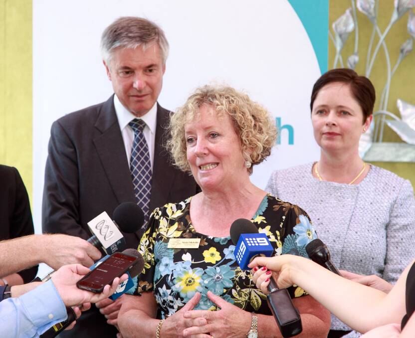 Pleasing result: Albury Wodonga Health board member Nicki Melville speaks to the media as member for Albury Greg Aplin and Mental Health Minister Tanya Davies watch on. Picture: SIMON BAYLISS