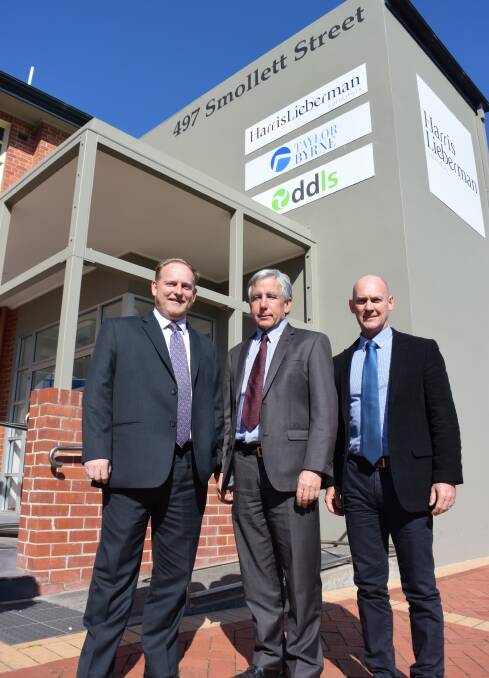 New sign up: Cosgraves chiefs Andrew Kemp and Bert Eastoe with Taylor Byrne head Geoff Duffield outside their rebadged office in central Albury.
