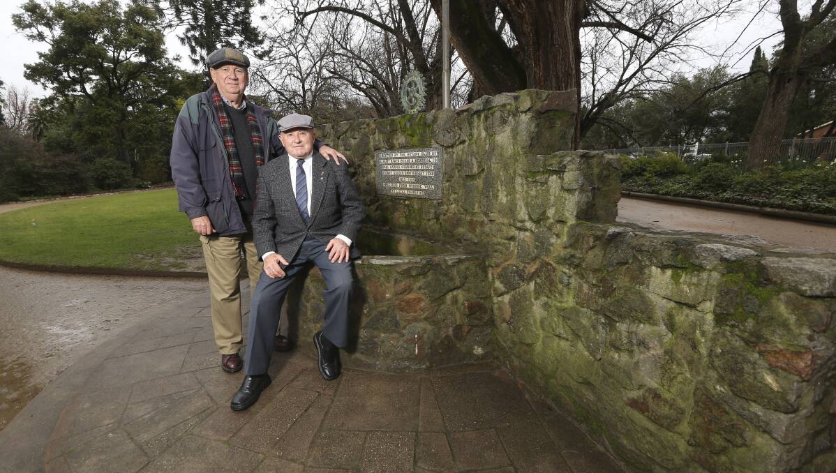 Callout: Geoff Emerson and Ken Curnow at Albury Botanic Garden's 1955 fountain which was erected by their club. Picture: ELENOR TEDENBORG
