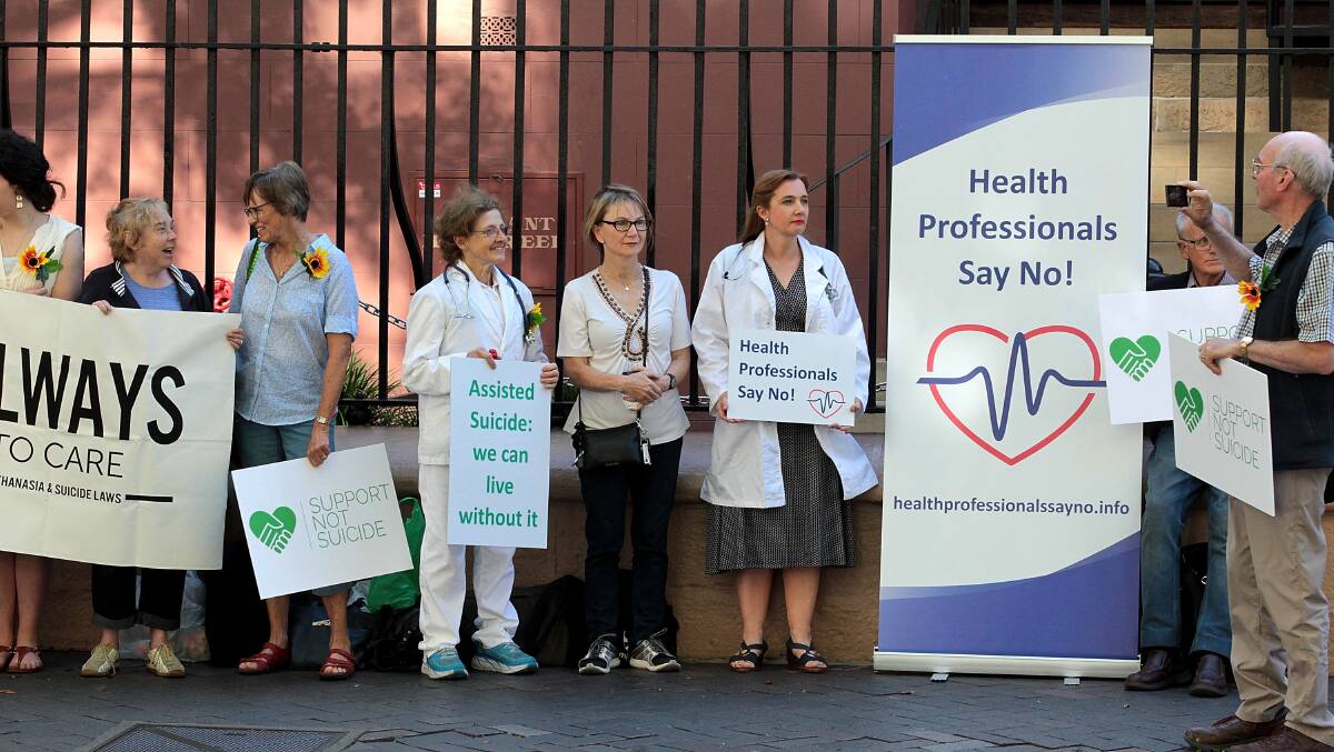 Objectors: Medical professionals against legalised euthanasia protest outside Parliament House in Sydney during debate on an assisted-dying bill on Thursday.