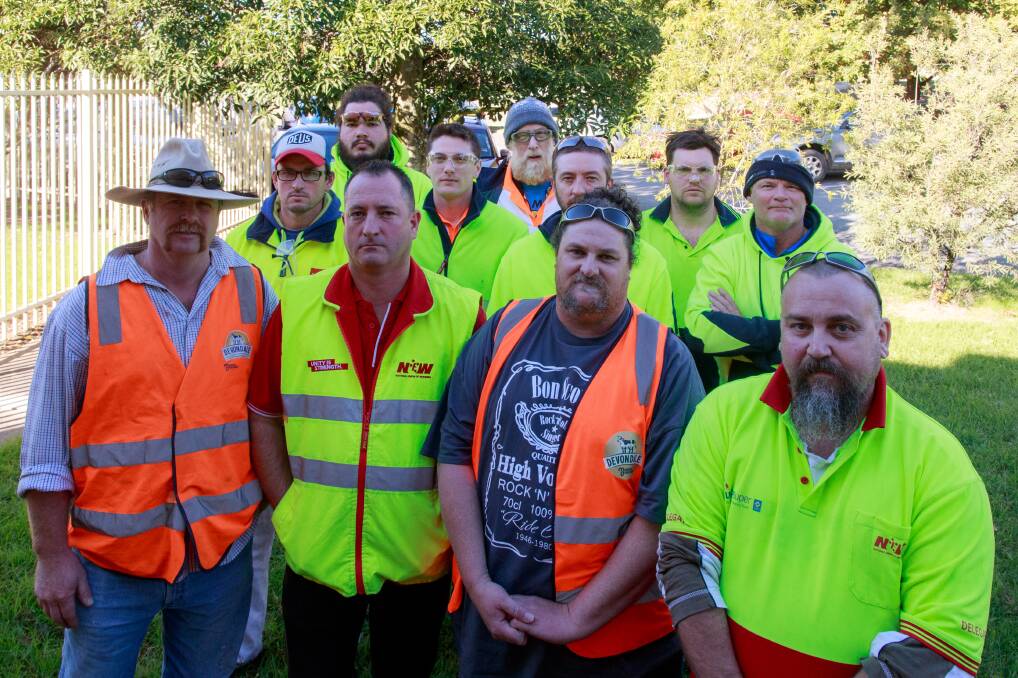 Grim future: Murray Goulburn workers, including Andrew "Snags" Cameron (far right), who face the prospect of their jobs terminating in July. NUW North East organiser Neil Smith is second from left in front. Picture: SIMON BAYLISS  