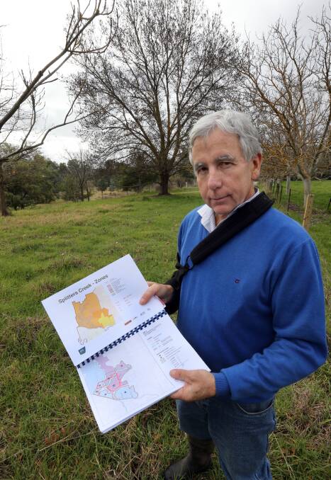 Plan in hand: Splitters Creek resident Bert Eastoe believes it is reasonable for Albury Council to consult further on bushfire concerns in his area.