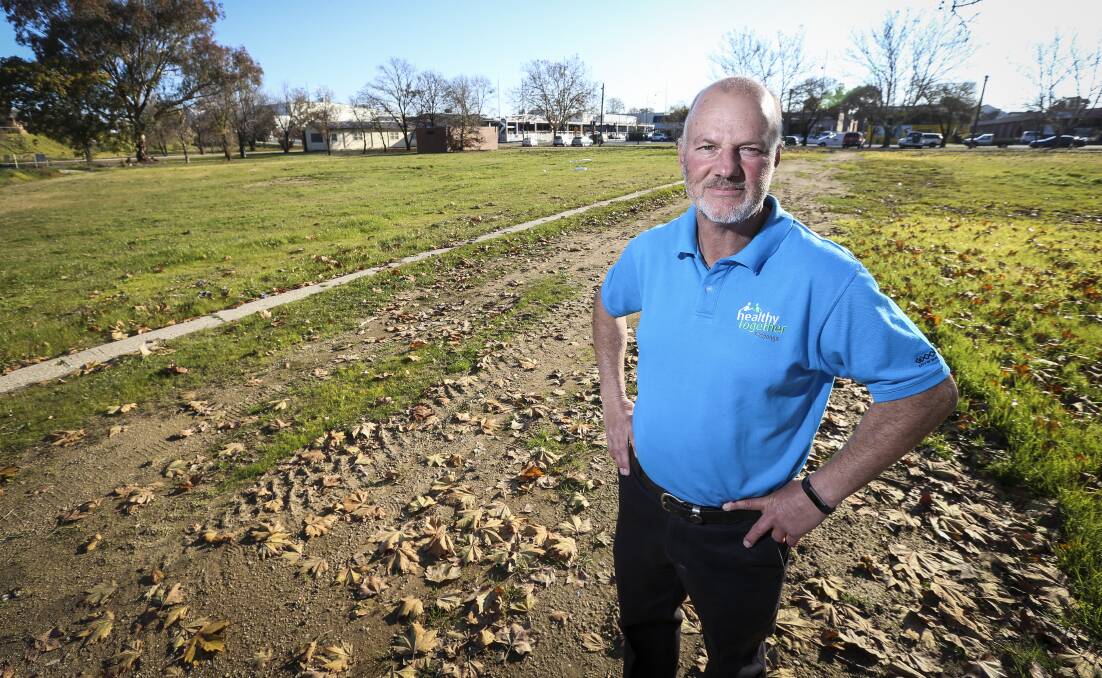 Space available: Mike Fraser on land separating the city's band hall and bowls club in Hovell Street which he believes is suitable for caravan and campervan parking. Picture: JAMES WILTSHIRE