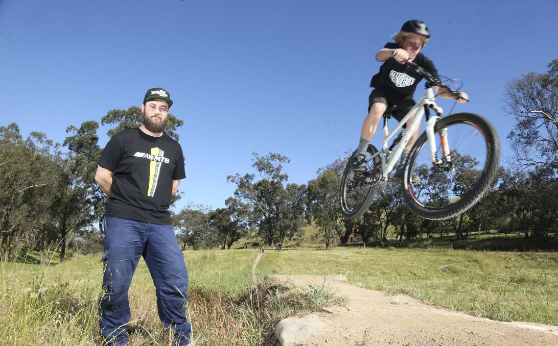 Off limits: Albury Wodonga Mountain Bikers president Michael Ross with Angus Eberle, 14, at a Hunchback Hill trail. Picture: ELENOR TEDENBORG