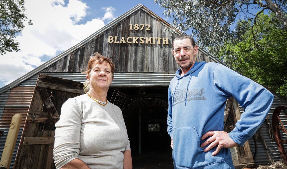 Heritage building: Marg Wehner and Jindera Pioneer Museum volunteer Jason Pollard at the blacksmith's shop which dates back to the first decade of Jindera's settlement. Picture: JAMES WILTSHIRE