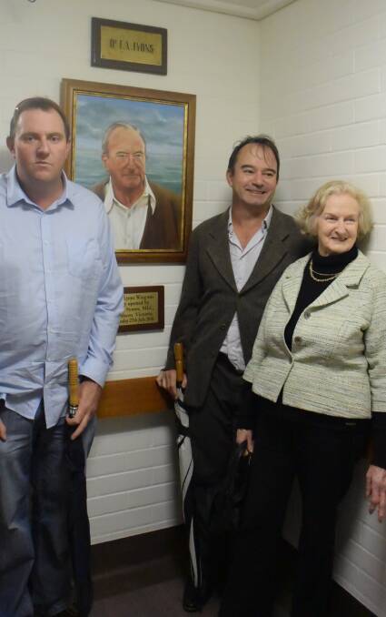Great tonic: Sons Chris and Andrew join their mother Terry Lyons in the newly-named Frank Lyons wing which features a portrait of the late doctor.