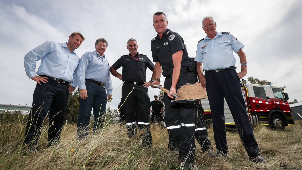 Big day: Ashley Mills turns the first sod before builders Brian Sawyer and John Tyrrell and CFA operations manager Paul King and Wodonga brigade chairman Des Milbourne. Picture: JAMES WILTSHIRE