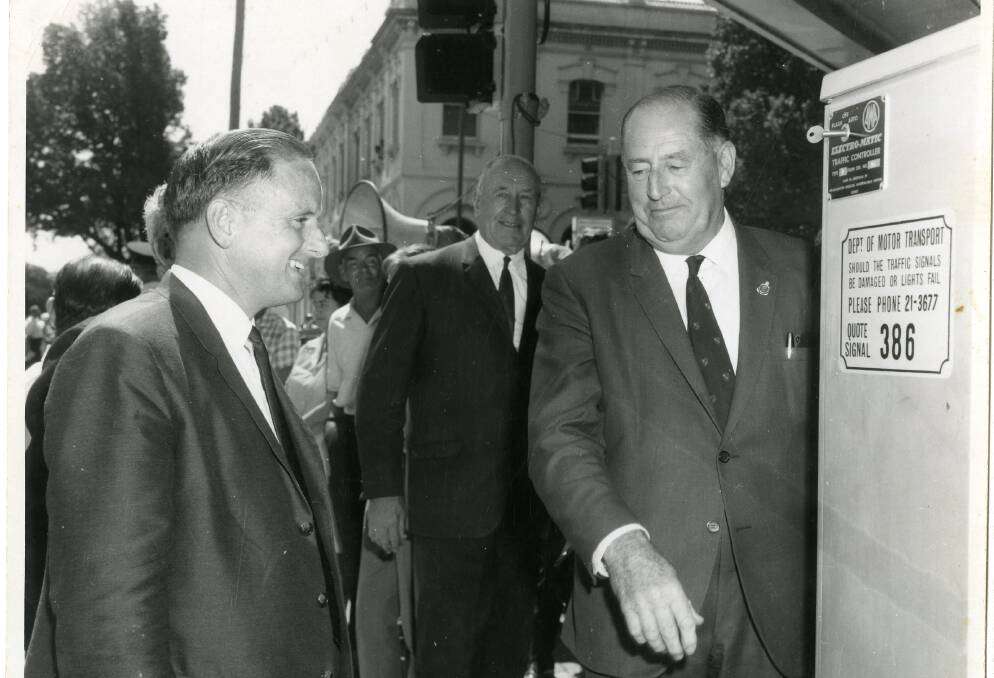 Go: MP Gordon Mackie (right) and mayor Cleaver Bunton (centre) with a control    
box at the traffic lights opening on March 13, 1967. Picture: ALBURY CITY COLLECTION