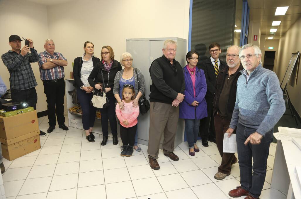 High price: A large number of candidates for the Wodonga Council election saw the cost of the poll exceed the original estimate. Pictured are some of the candidates at the ballot draw for the vote.