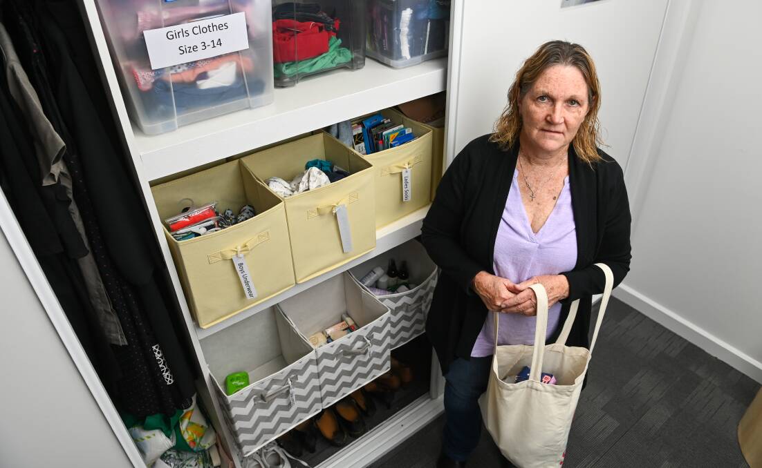 Marge Nichol with some of the goods that her organisation has to assist families affected by household thuggery. Picture by Mark Jesser