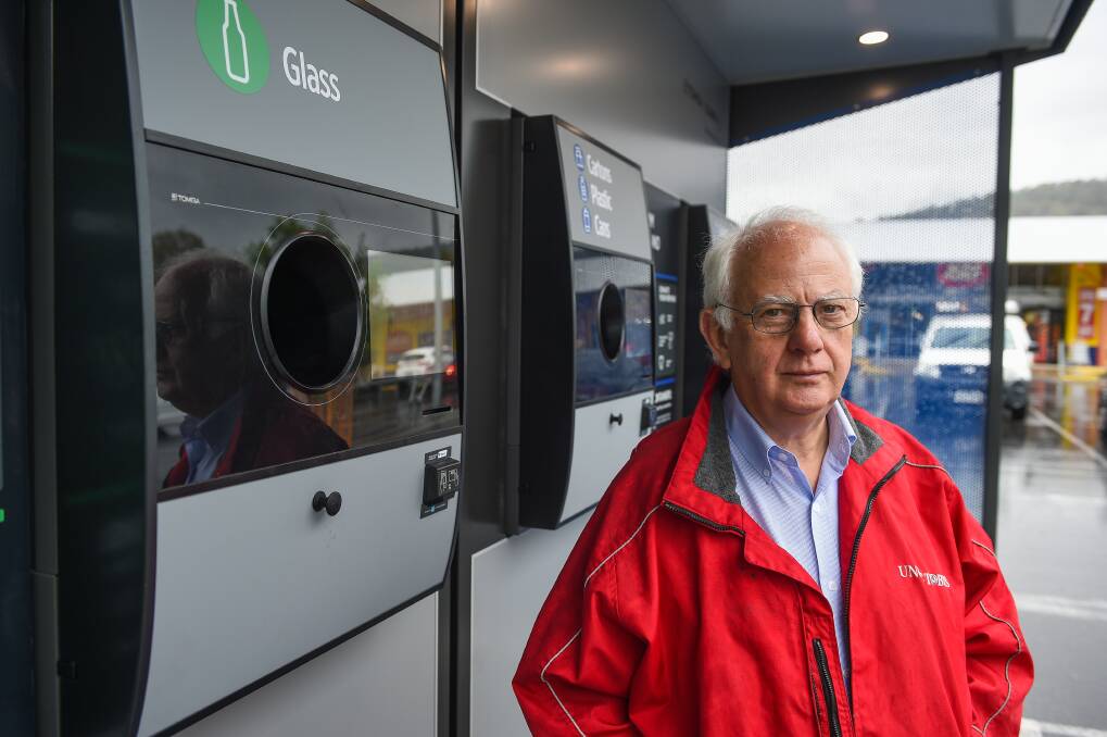 Frustrated: IGA supermarket owner Bob Mathews at the reverse vending machine outside his store. He believes it is not delivering the benefits he was promised. Picture: MARK JESSER 