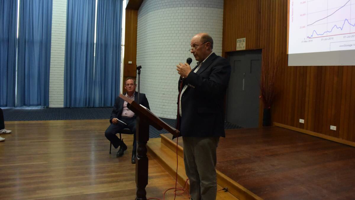 Taking the heat: Murray-Darling Basin Authority executive director river management David Dreverman responds to questions at Corowa on Wednesday night as meeting chairman Fred Longmire looks on.