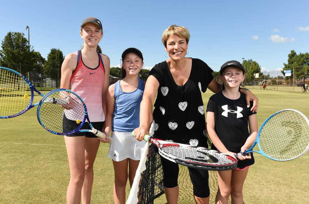 Hoping to net a prize: Wodonga mayor Anna Speedie with the tennis-playing Ebert sisters - Sophie, 14, Molly, 12, and Chloe, 8, at the Wodonga Tennis Centre earmarked for the Commonwealth Games in 2030. Picture: MARK JESSER
