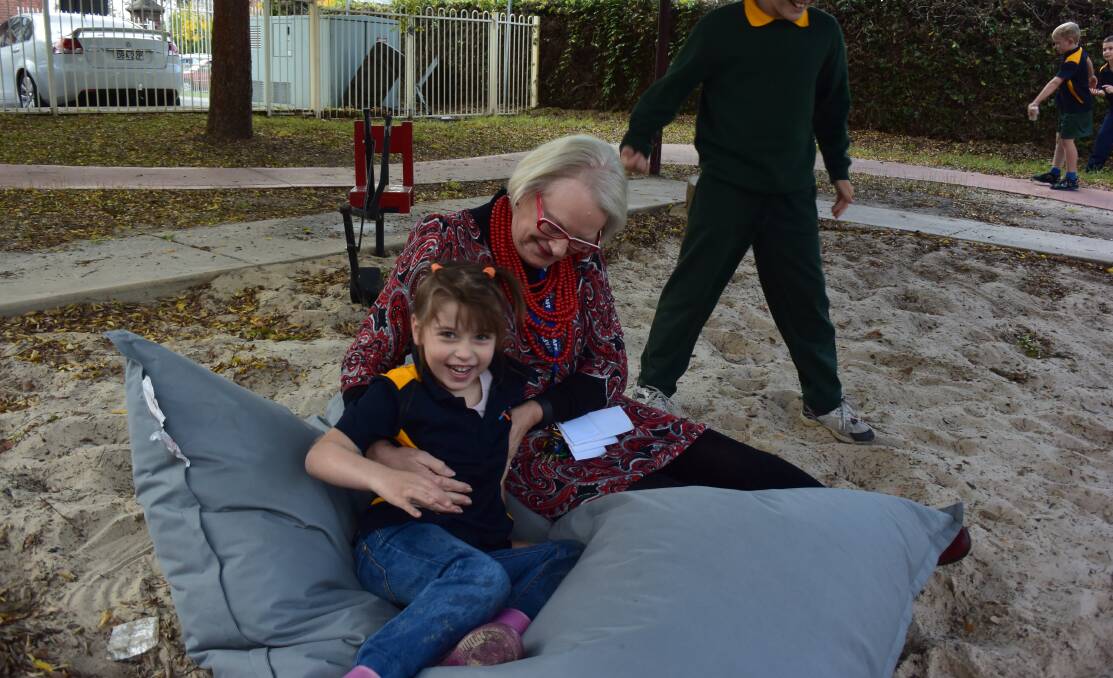 Soft landing: Kinder student Isabelle Thornton, 5, with Aspect principal Jo Gillespie on a beanbag bought as part of a school donation program.