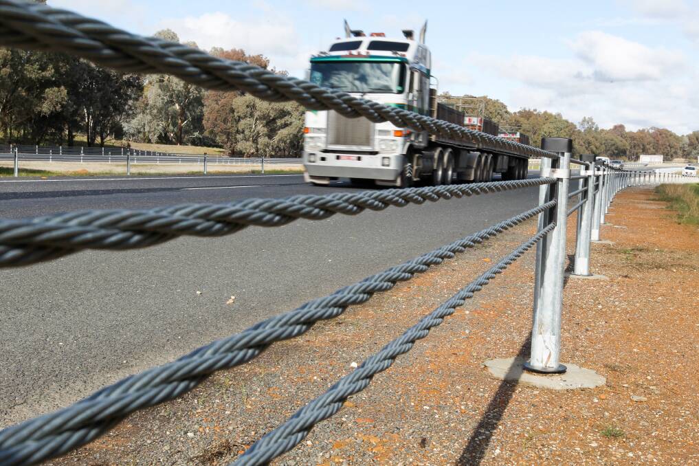 On the ropes: A section of the new wire safety barriers on the Hume Freeway installed between Wodonga and Wangaratta last year.