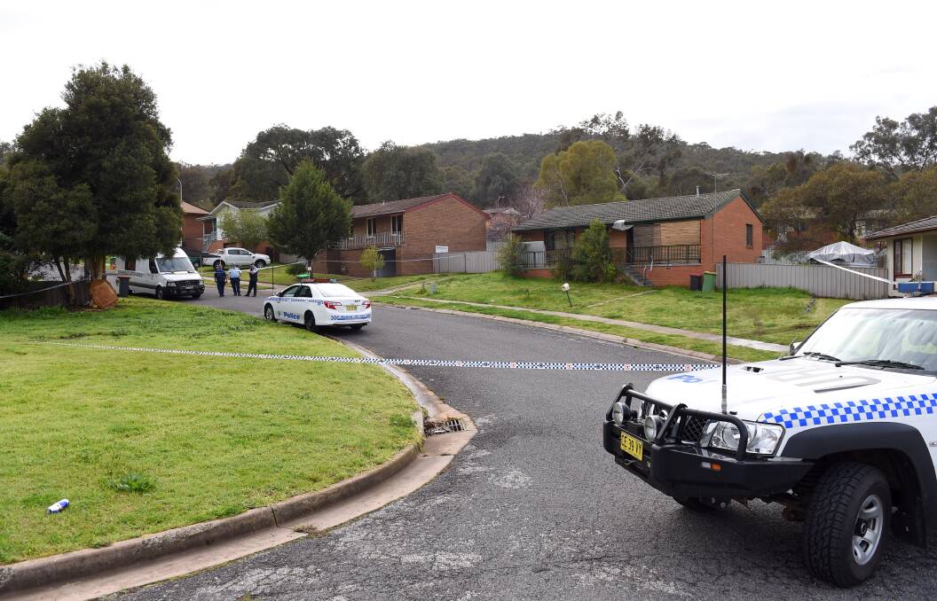 Tragic scene: Police at the West Albury house where Scott Dickinson was allegedly murdered earlier this month.