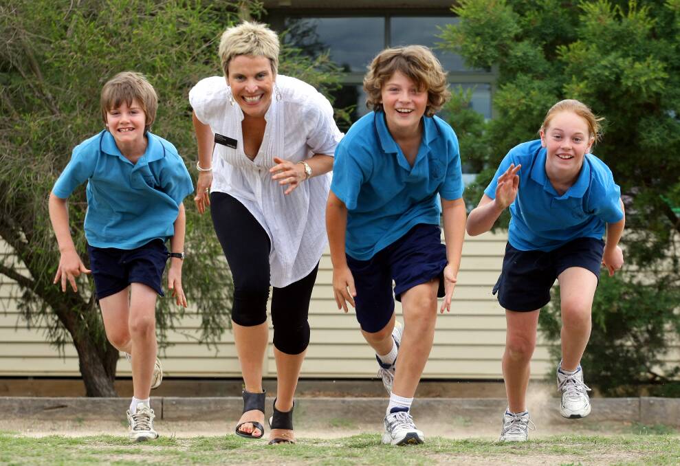 Easy run: Anna Speedie with Wodonga South Primary School students in 2009. She has promoted the lack of zoning for schools as an attraction to living in Wodonga. 