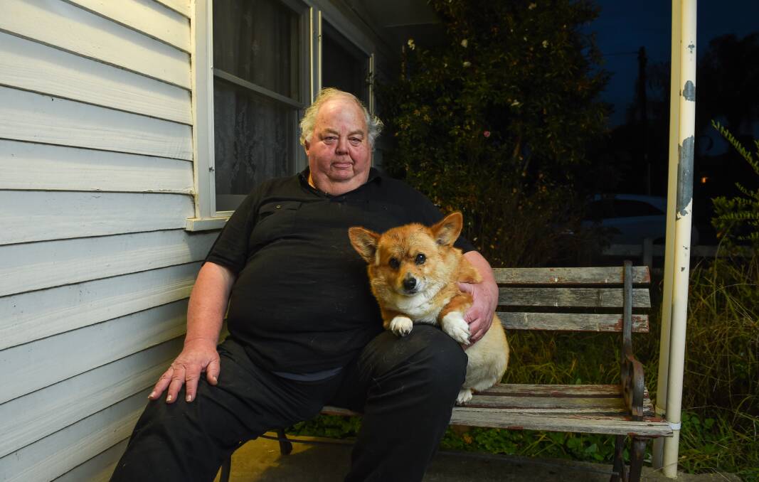 In for the long haul: Jeffrey Sill is determined to win a legal fight with Wodonga Council over its enforcement of a dog registration fee for his corgi Eckles. Picture: MARK JESSER 