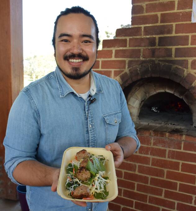 Asian fusion: Celebrity chef Adam Liaw with his Vietnamese rissoles which were cooked in the wood-fired oven at Albury's Hovell Tree Park.