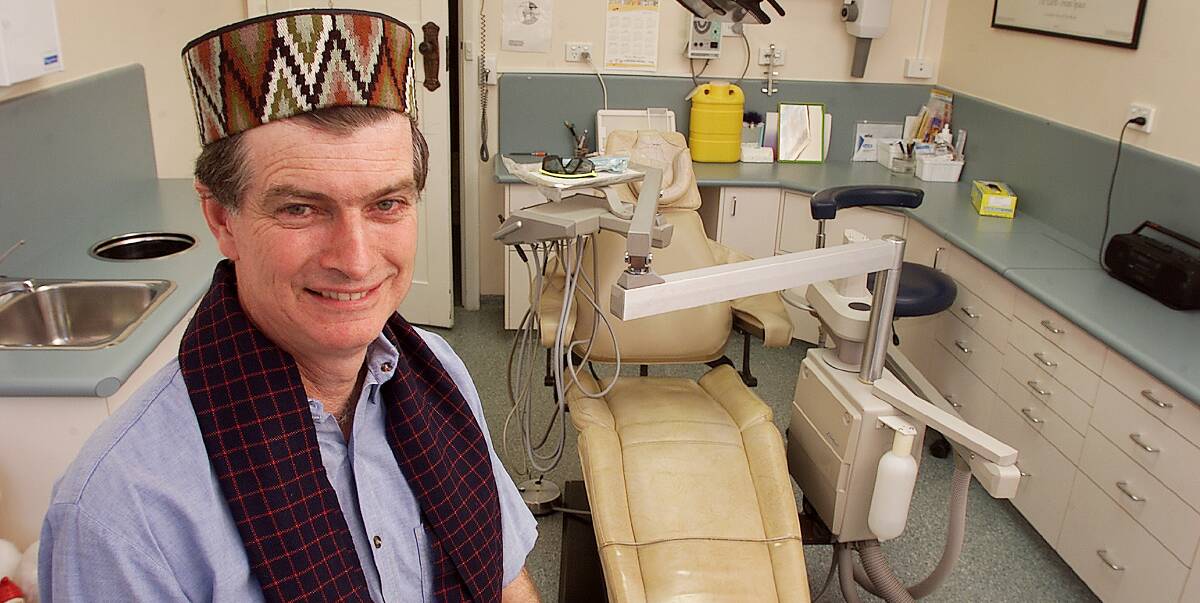 Popular figure: Dentist Jim Poyner has been remembered for his professional leadership and generous nature following his death at the age of 65. He is pictured in 2002 after returning from India with a local hat and scarf.