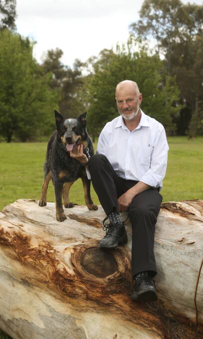 Aiming high: Wodonga councillor Mike Fraser with his dog Charlie at Willow Park. He would like to become mayor if re-elected. Picture: ELENOR TEDENBORG