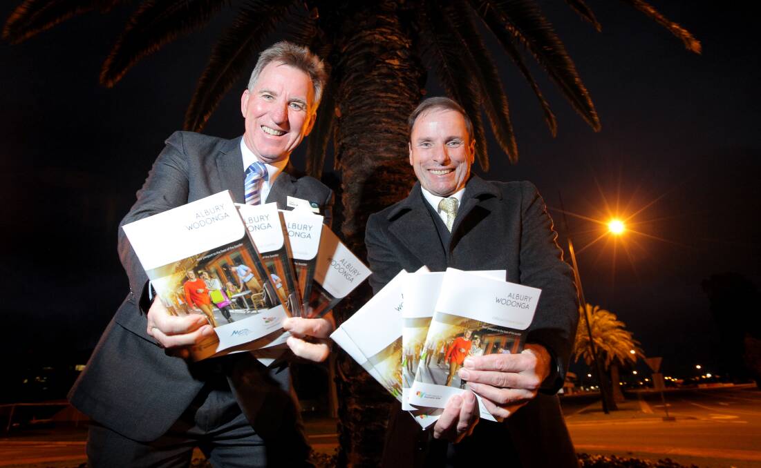 Promoting the region: Albury mayor Kevin Mack with then Wodonga mayor Rodney Wangman at the launch of a twin cities visitor guide in 2014.