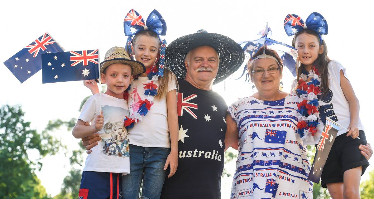 Flagging support: Wodonga's Larry and Ruth Turner with their grandchildren Jack, Lucy and Eliza Summerill, of Albury, at Wodonga celebrations. Pictures: MARK JESSER