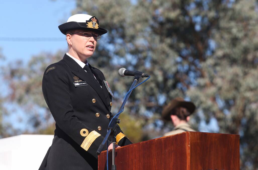 Message of understanding: Commodore Michele Miller speaks at Albury's Anzac Day ceremony. She is the third generation of her family to serve in the military.
