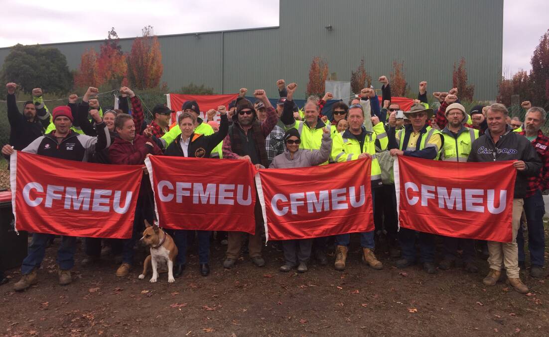 Fired up: ACTU secretary Sally McManus joins striking Carter Holt Harvey mill workers on a picket line outside the Myrtleford factory on Thursday morning.
