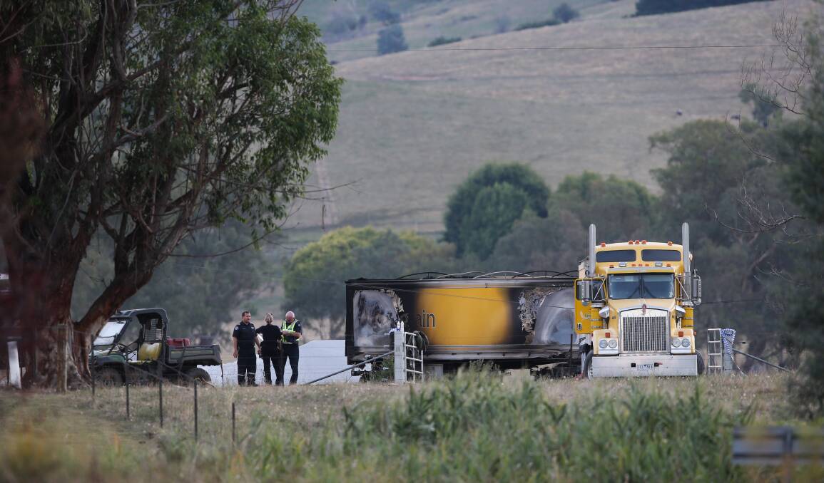 Tragic situation: Emergency service personnel at the farm where a truck driver died after his heavy vehicle was believed to hit power lines. Picture: KYLIE ESLER
