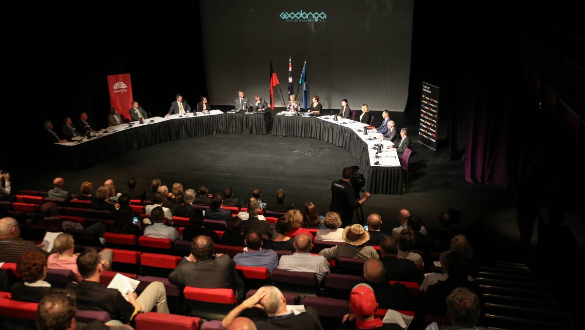 Two for one: Albury councillors were to the left and their Wodonga counterparts were to the right as they gathered at The Cube for separate meetings to pass a formal agreement.