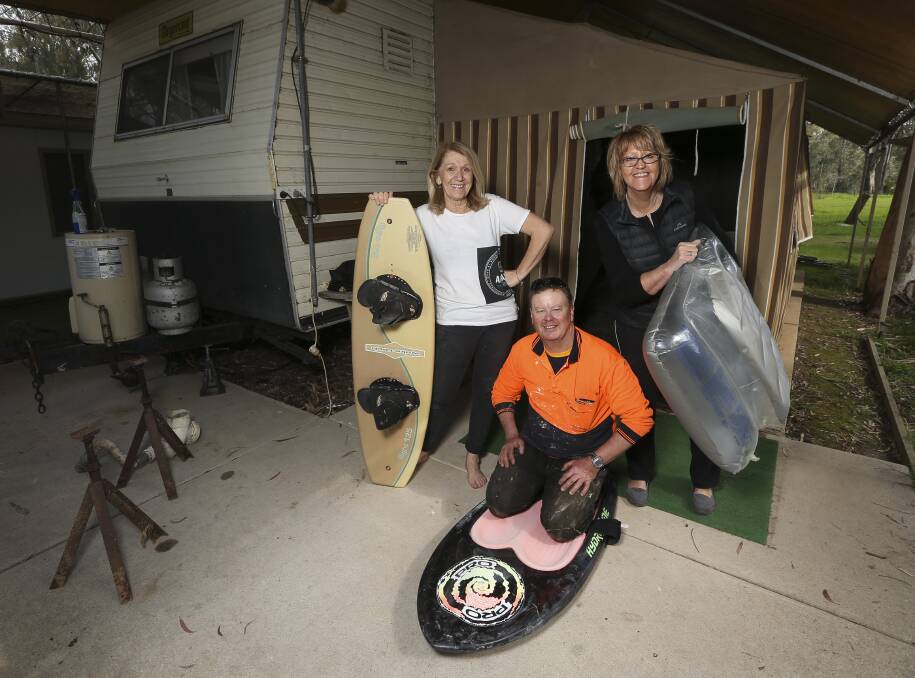 Moving day: Di Jorgensen was helped by friends Stephen Wallis and Sue Davis as she prepared to have her van towed to higher ground. Picture: ELENOR TEDENBORG
