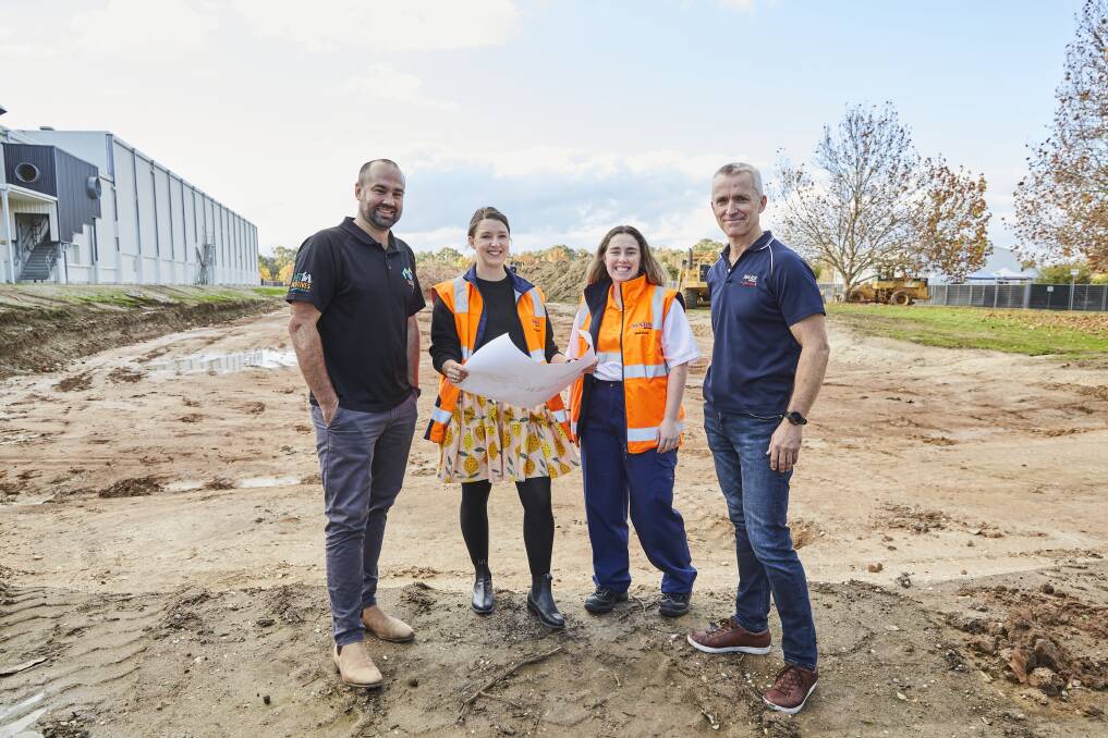 Project engineer Aaron Pitson, product developer Peta Nelson, engineer trainee Demi Shale and Wodonga plant director Brett Brown with plans for the new factory at the time of its construction launch in 2023. Picture supplied