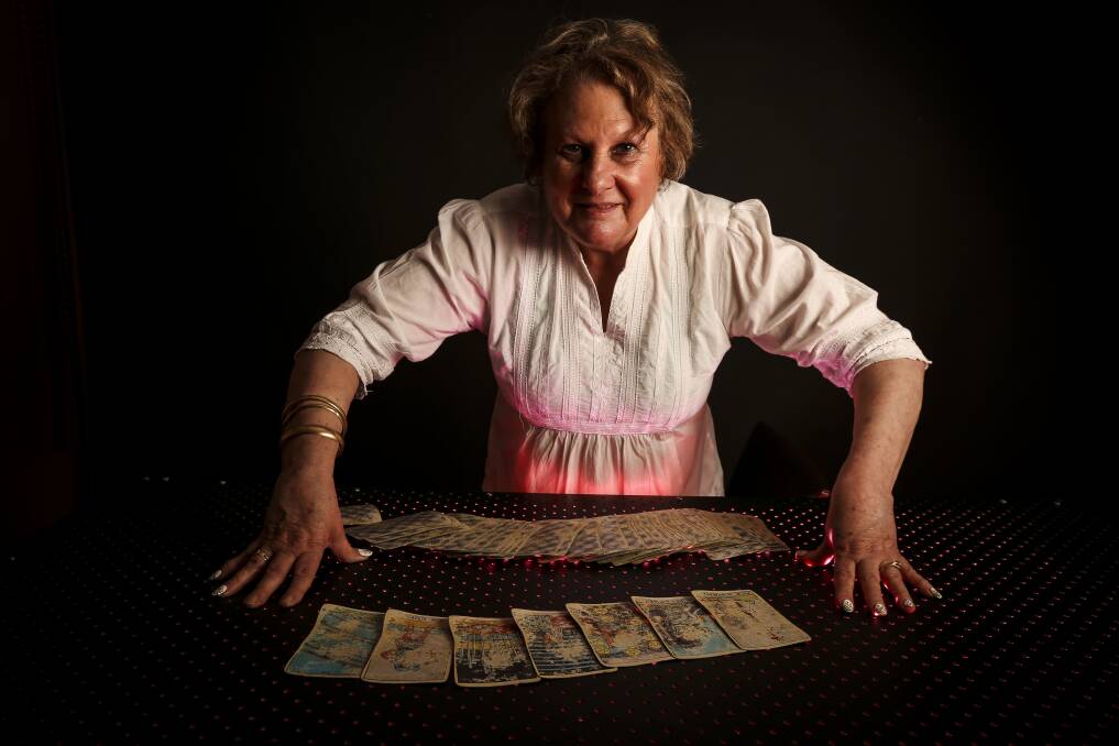 Fortune teller: Maria Campbell with tarot and oracle cards she uses to predict clients' fates. Picture: JAMES WILTSHIRE