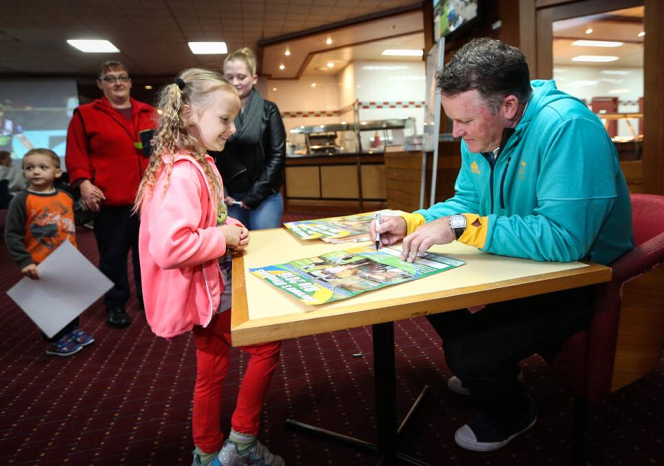 Thanks Marcus: Corowa's Leticia True, 6, has her poster autographed at the golf club.  