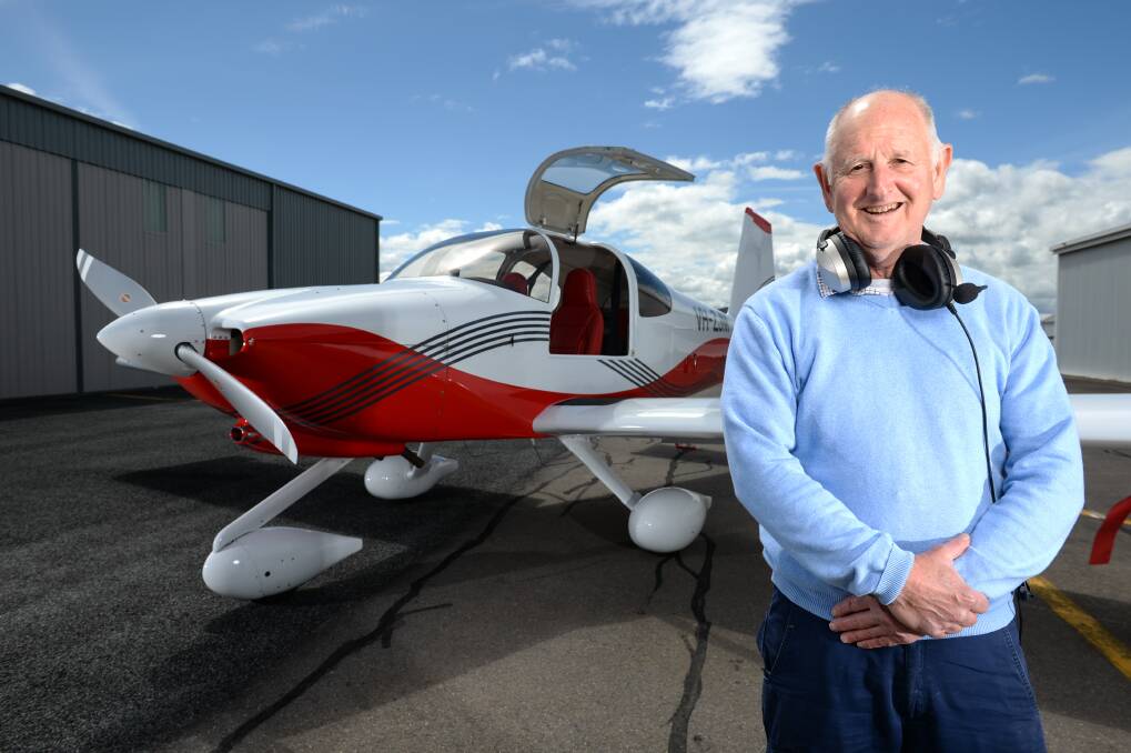 High-flyer: Martin Daniell with his light plane which he has built from a kit. It will be on display as part of the Albury Aero Club's open day on Saturday. Picture: MARK JESSER