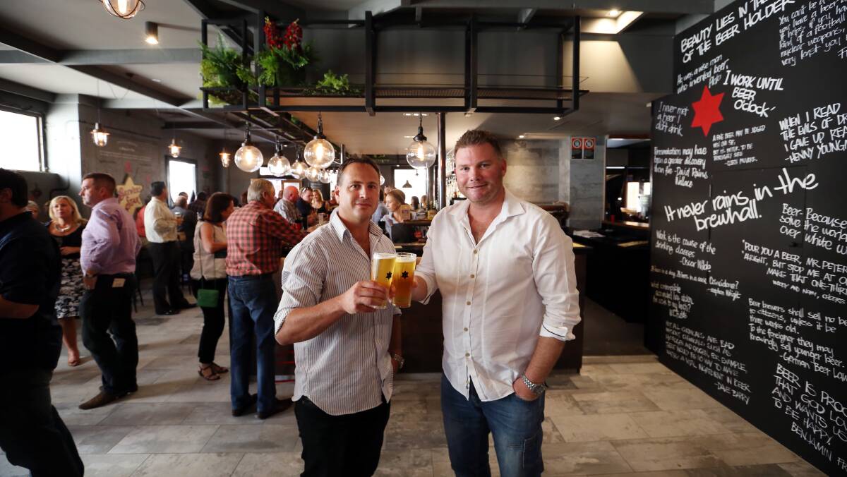 Here's cheers: Border hotel co-owners Jason Sheather and Craig Shearer at the launch of Albury's Beer DeLuxe in December 2014. The hotel has been sold to a Melbourne hospitality group.
