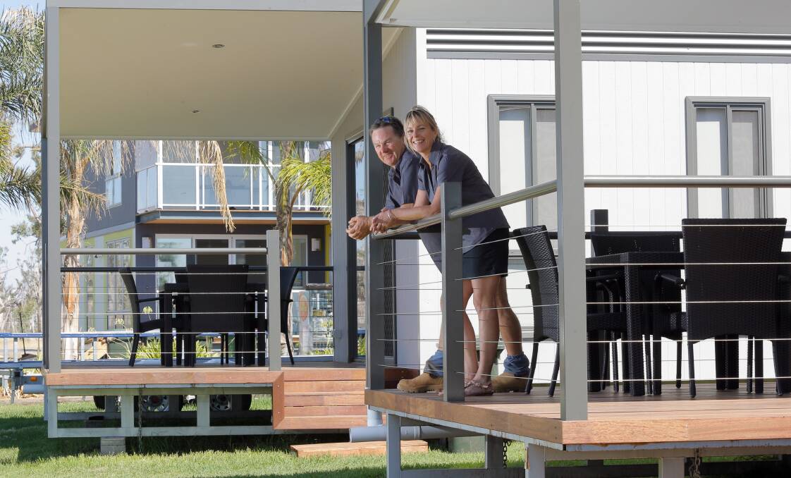 Disability friendly: Craig and Deb O'Callaghan at one of their cabins at their caravan park on Lake Mulwala. They hope to cater for more disabled tourists with a new cabin and playground.